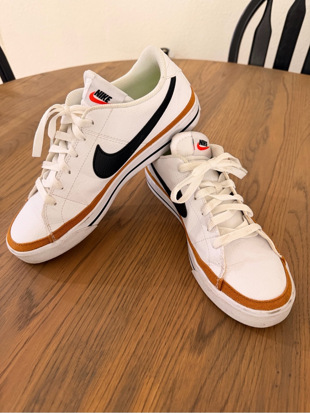 Nike Women’s White Low-Top Sneakers with Black Swoosh and Brown Accent